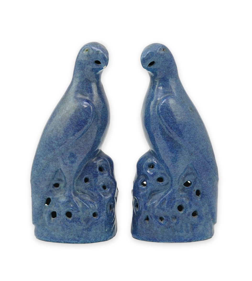 A pair of Chinese blue mottle glazed models of parakeets, 19th century